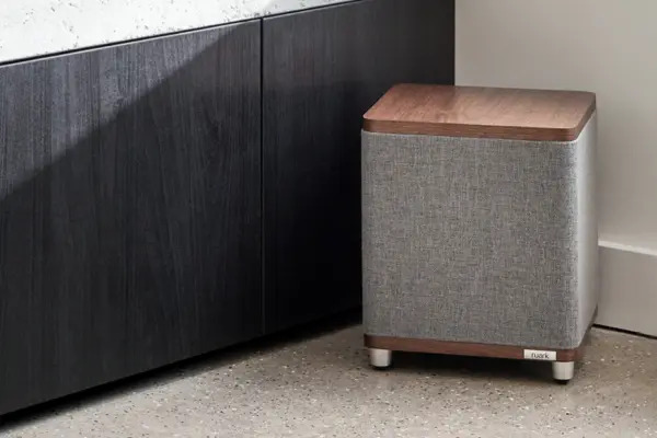 Ruark in Rich Walnut veneer with slate grey fabric grille finish